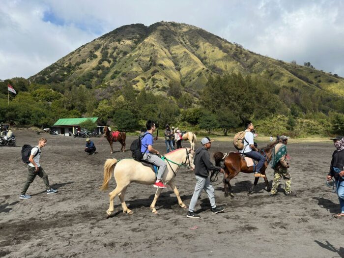riding a horse at Mount Bromo