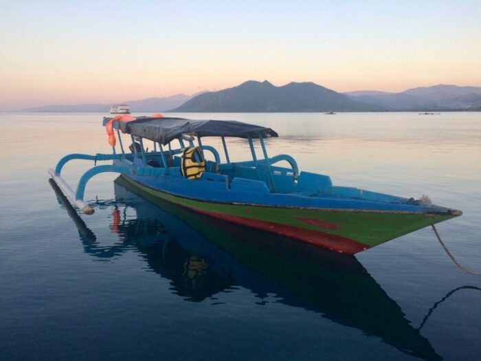 traveling by a small boat in indonesia