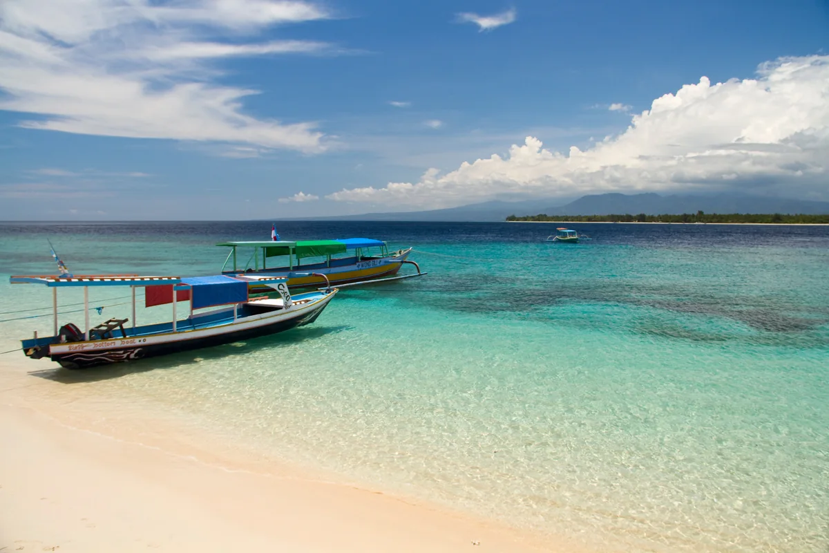 Boat in turquoise water at the Gili Islands