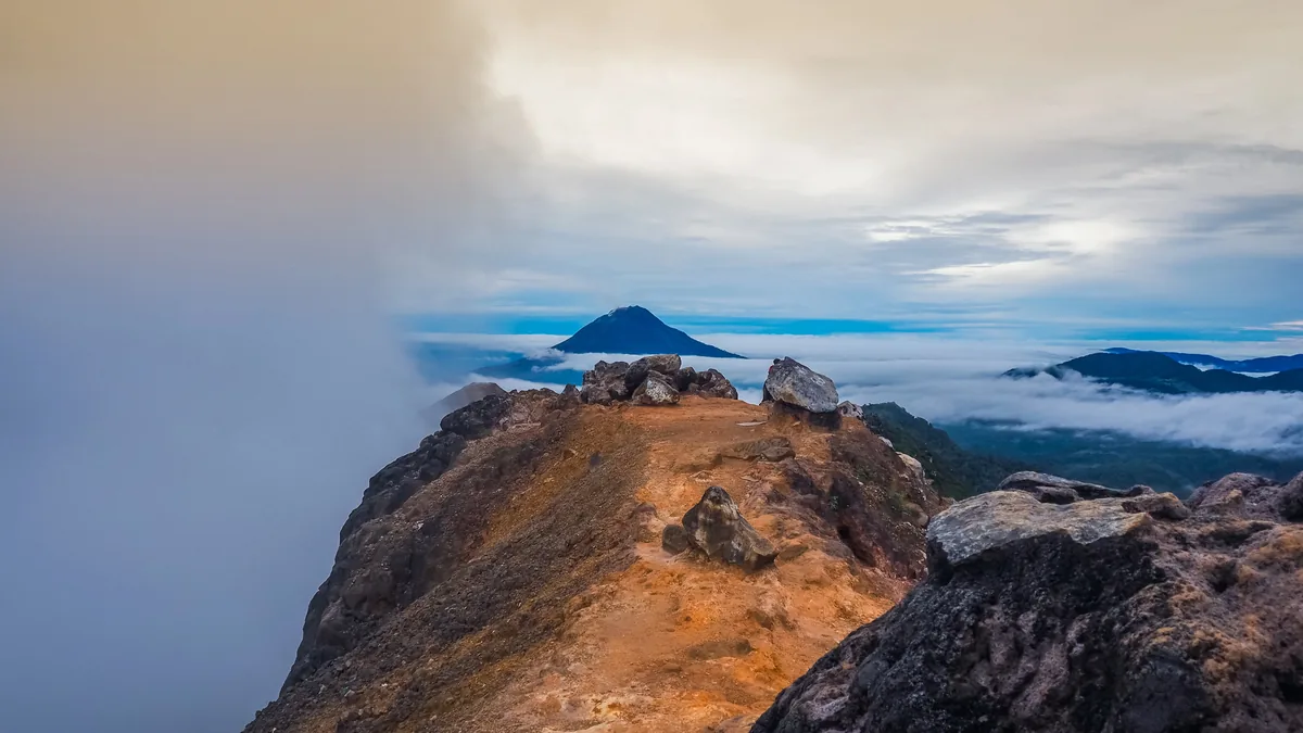 Sunrise light over the rocky ridge of Mount Sibayak
